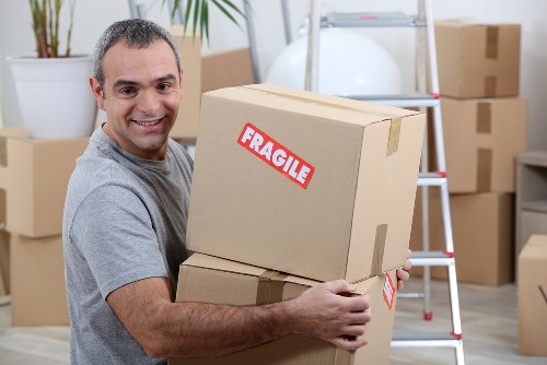 Professional packing team handling boxes