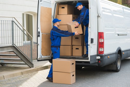 Front view of a moving van outside a suburban Egham home