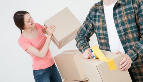 Professional house removalists loading furniture