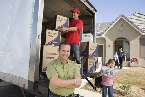 Professional movers handling furniture pick-up in Egham
